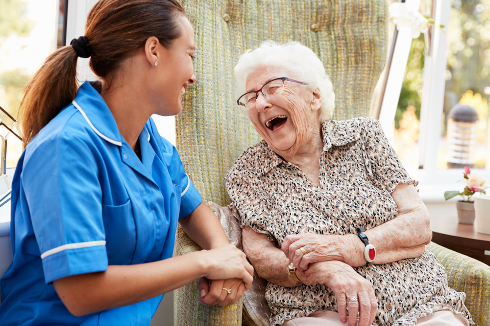 Nurse Laughing with Senior Patient